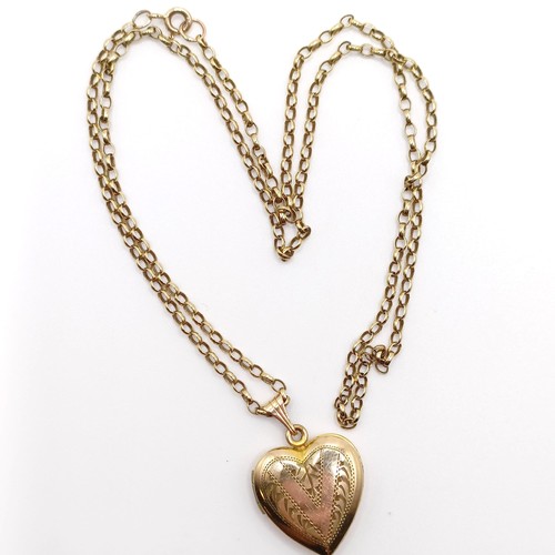 685 - A 9ct heart shaped locket, on a yellow metal chain