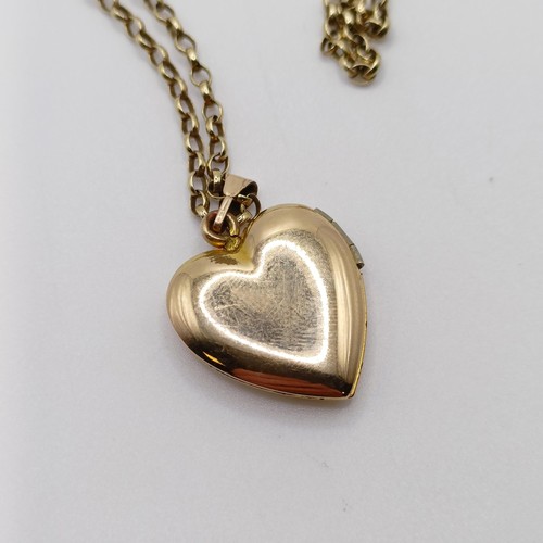 685 - A 9ct heart shaped locket, on a yellow metal chain