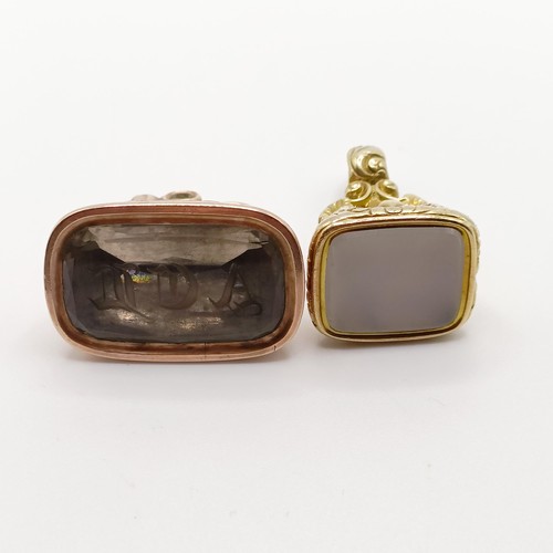 680 - A 19th century yellow metal and white stone seal, and another (2)