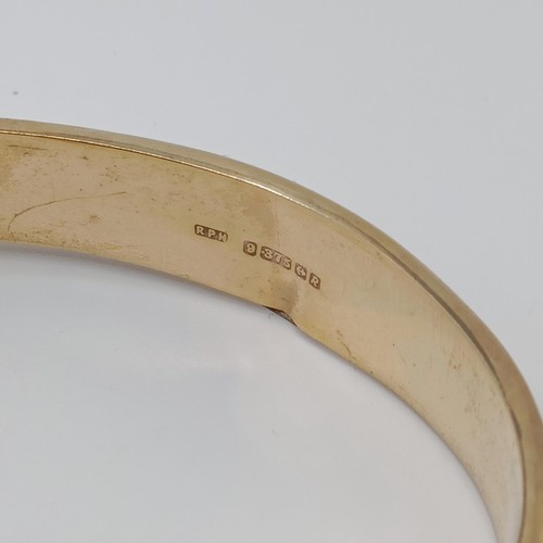 725 - A 9ct gold bangle, 12.7 g