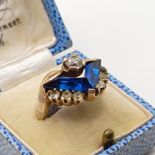 748 - A 1940's style yellow metal, white and blue stone ring, ring size M, in a vintage jewellery box