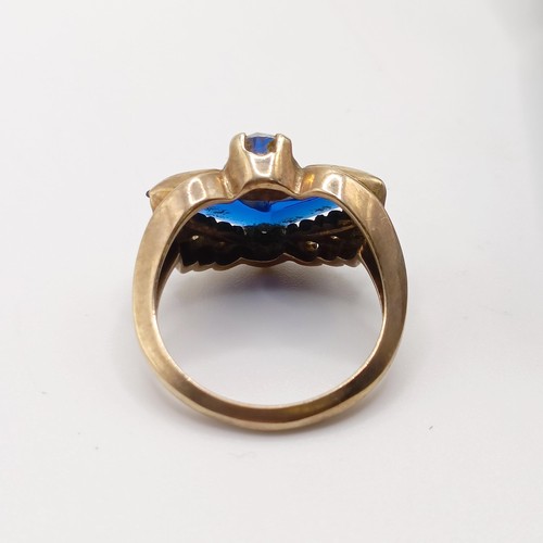 748 - A 1940's style yellow metal, white and blue stone ring, ring size M, in a vintage jewellery box