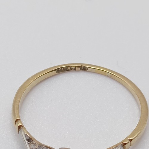 751 - A 22ct gold wedding band, ring size O, 2.5 g, and two other rings