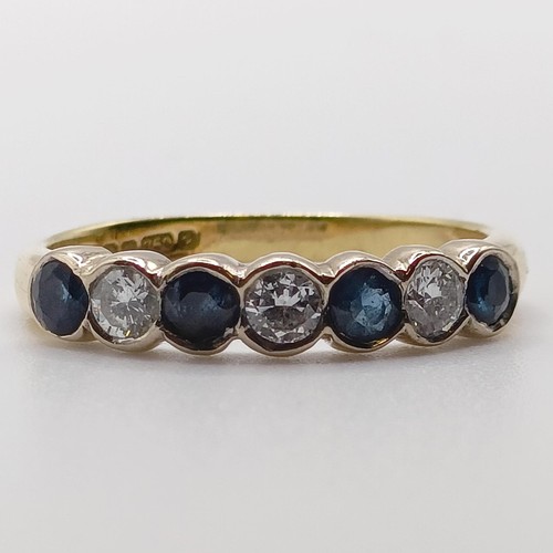 752 - An 18ct gold, diamond and sapphire ring, ring size J