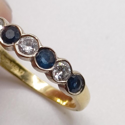 752 - An 18ct gold, diamond and sapphire ring, ring size J