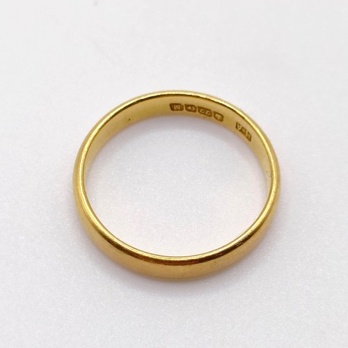 765 - A 22ct gold wedding band, ring size H, 2.6 g