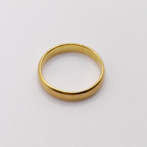 765 - A 22ct gold wedding band, ring size H, 2.6 g