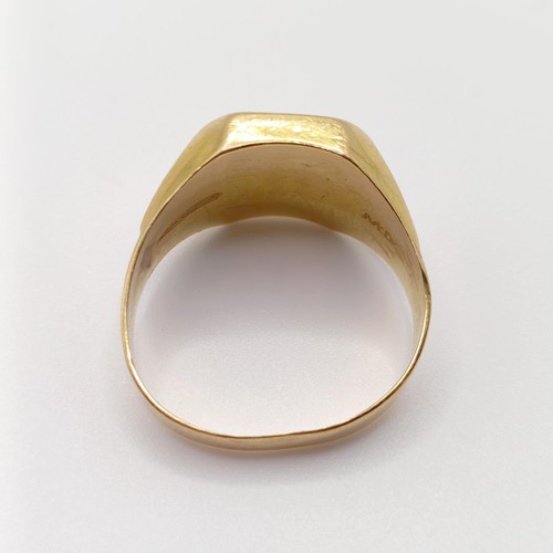 766 - A yellow metal signet ring, ring size R