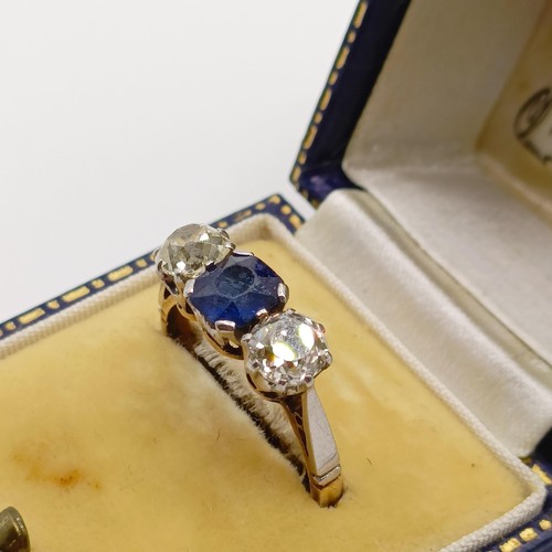 768 - An 18ct gold, sapphire and diamond three stone ring, ring size N, in a vintage jewellery box, retail... 