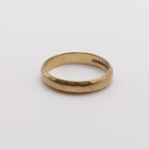 769 - A 9ct gold wedding band, ring size U, 3.6 g