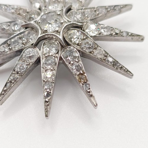 777 - A late Victorian diamond star pendant/brooch, with a loose fitting, 3.5 cm diameter