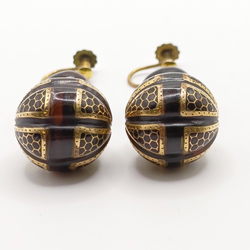 779 - A pair of late Victorian tortoiseshell earrings, with yellow coloured metal inlay