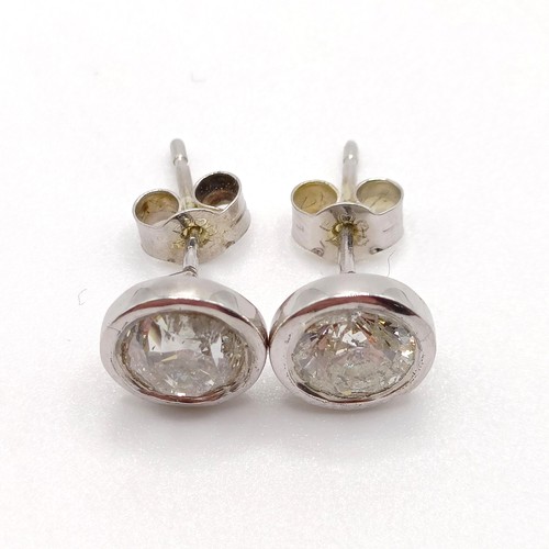 938 - A pair of diamond ear studs, approx. 1ct each