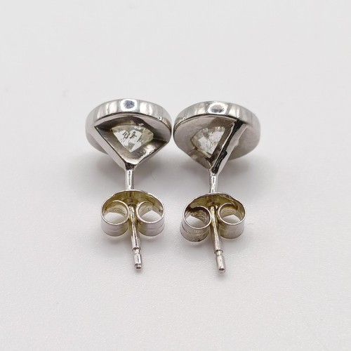 938 - A pair of diamond ear studs, approx. 1ct each