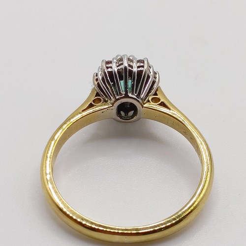 937 - An 18ct gold, emerald and diamond cluster ring, ring size M, and a dress ring, in a vintage jeweller... 