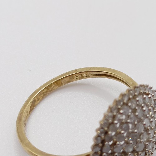 934 - A 9ct gold and diamond ring, ring size R