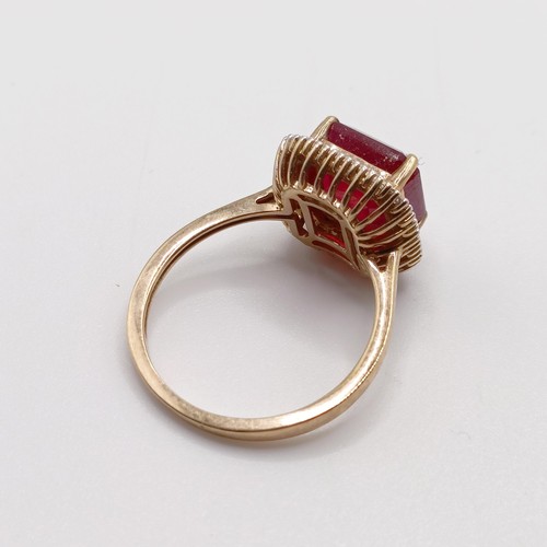 927 - A 9ct gold, red stone and diamond ring, ring size Q