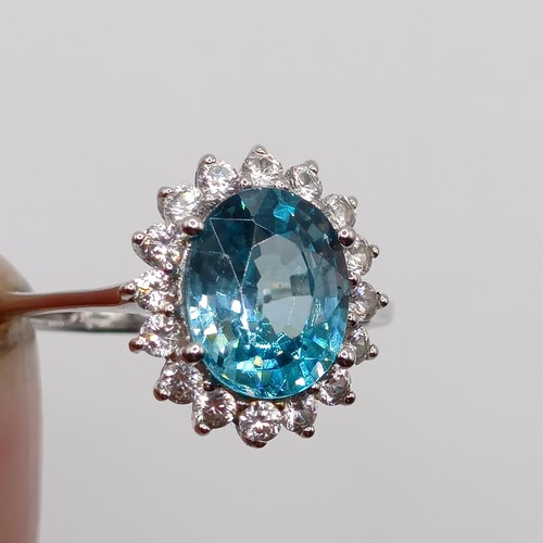 925 - A 9ct white gold blue stone ring, ring size S, and a 9ct gold blue stone and diamond ring, ring size... 