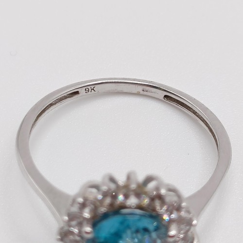 925 - A 9ct white gold blue stone ring, ring size S, and a 9ct gold blue stone and diamond ring, ring size... 