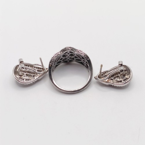 922 - A silver and purple stone dress ring, assorted dress rings, and three pairs of earrings