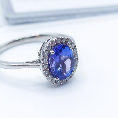 920 - A 9ct white gold, tanzanite and diamond ring, ring size T, with certificate