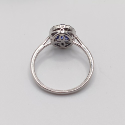 920 - A 9ct white gold, tanzanite and diamond ring, ring size T, with certificate