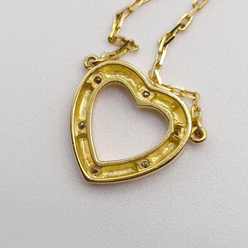 873 - An 18ct gold and diamond heart shaped pendant, on a chain