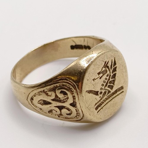 852 - A 9ct gold signet ring, ring size T, 8.6 g