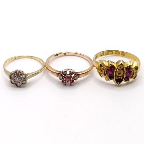 849 - A 9ct gold and red stone ring, ring size N, and two other rings (3)