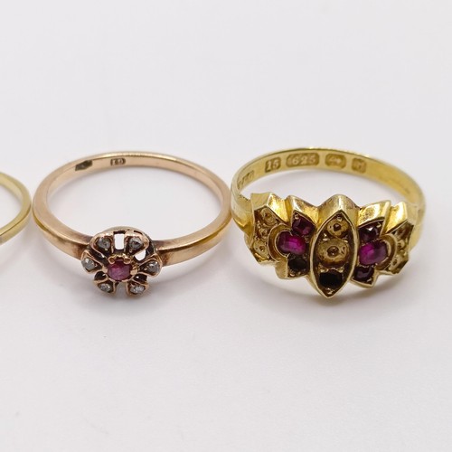 849 - A 9ct gold and red stone ring, ring size N, and two other rings (3)