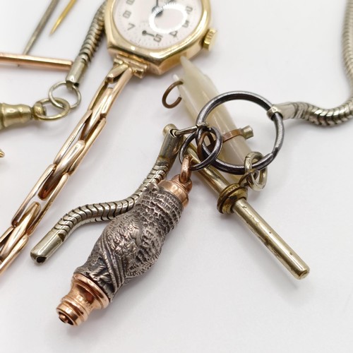 846 - A ladies 9ct gold wristwatch, a charm, a novelty whistle, in the form of an owl, on a silver plated ... 