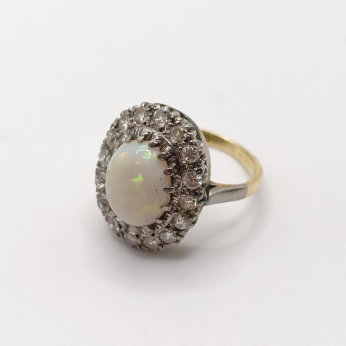 825 - An 18ct gold and platinum, diamond and opal ring, ring size H