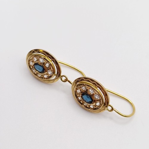 824 - A pair of 18ct gold, sapphire and white stone earrings