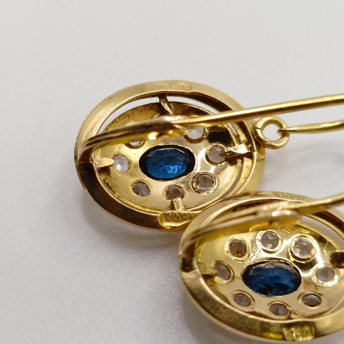 824 - A pair of 18ct gold, sapphire and white stone earrings