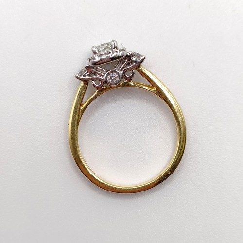 822 - A yellow metal and diamond cluster ring, ring size K