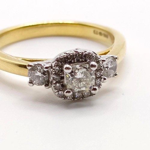 822 - A yellow metal and diamond cluster ring, ring size K