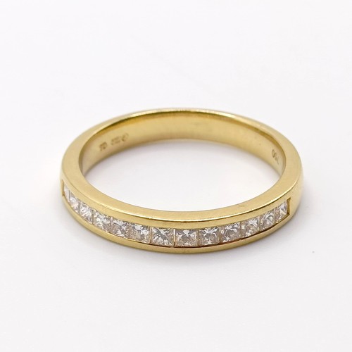 818 - An 18ct gold and diamond half eternity ring, ring size N