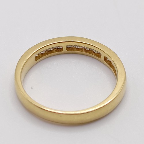 818 - An 18ct gold and diamond half eternity ring, ring size N