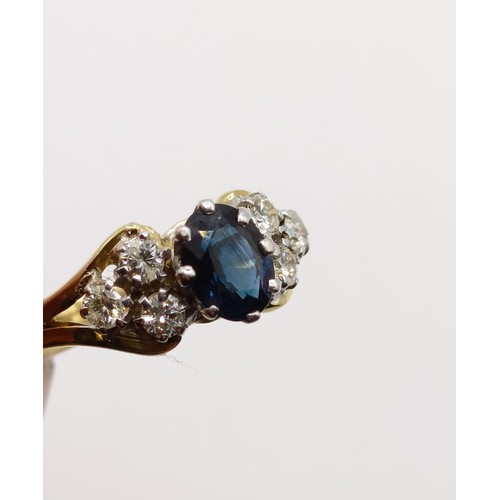 811 - An 18ct gold, sapphire and diamond ring, ring size M