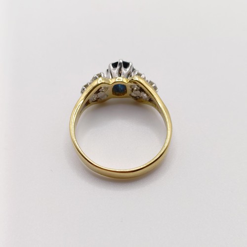 811 - An 18ct gold, sapphire and diamond ring, ring size M