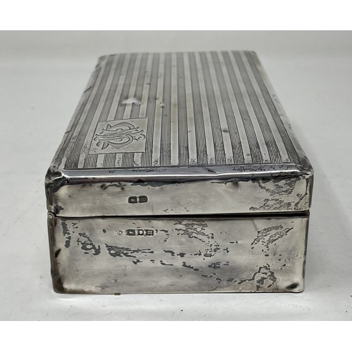 1089 - A George VI silver cigarette box, Birmingham 1935, 18 cm wide