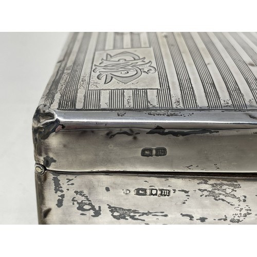 1089 - A George VI silver cigarette box, Birmingham 1935, 18 cm wide