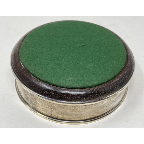 1092 - A modern silver and mahogany bottle coaster, 13 cm diameter