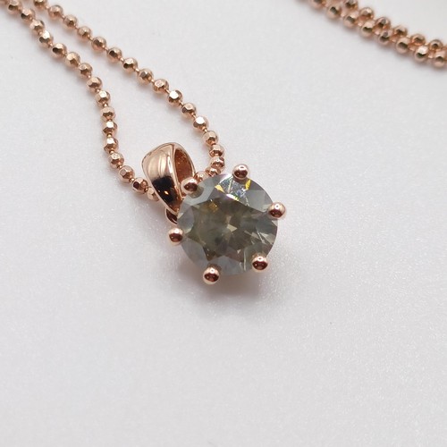 704 - A certificated 18ct rose gold, RBC diamond solitaire pendant, on a rose gold plated silver chain