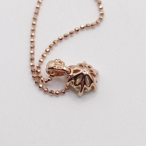 704 - A certificated 18ct rose gold, RBC diamond solitaire pendant, on a rose gold plated silver chain