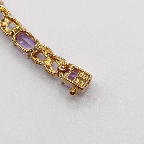 691 - A 9ct yellow gold, amethyst and diamond figure-of-eight bracelet, boxed