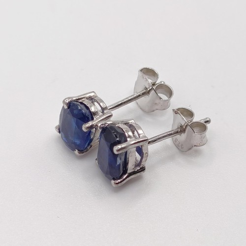 845 - A pair of kyanite studs, in silver