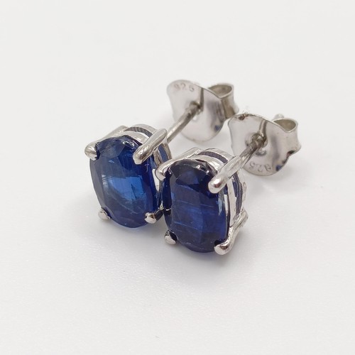 845 - A pair of kyanite studs, in silver