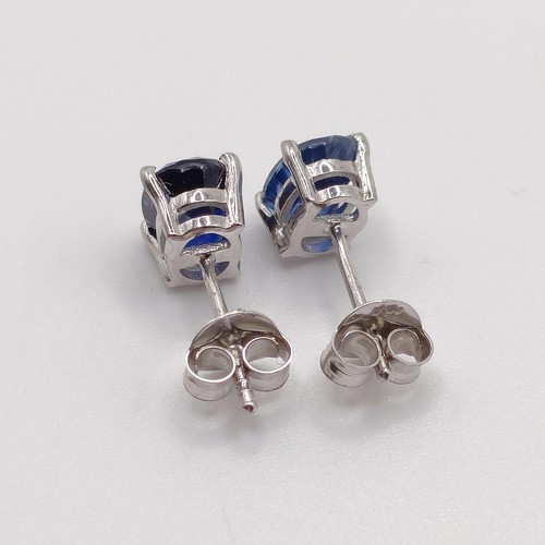 845 - A pair of kyanite studs, in silver