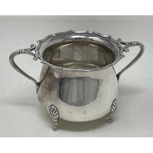 1098 - An Edward VII silver four piece tea set, comprising a hot water jug, teapot, cream jug and a sugar b... 